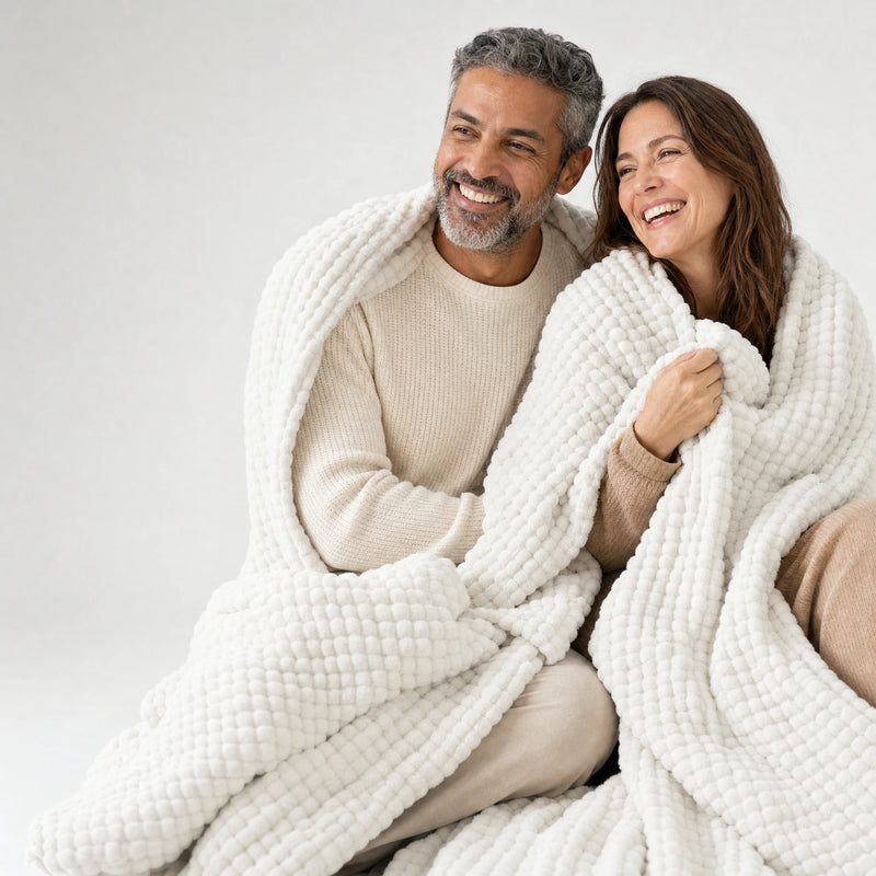 Couple laughing together under the Muslin Blanket in White