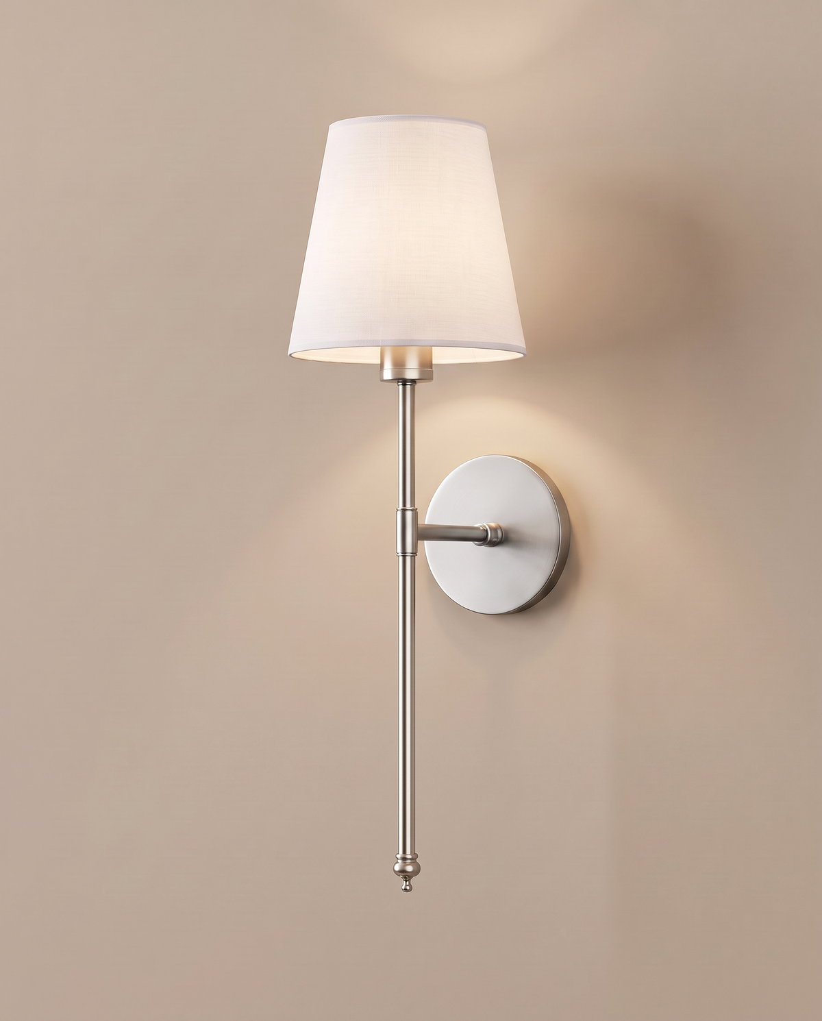 Wireless wall sconce glowing on a warm wall: Silver