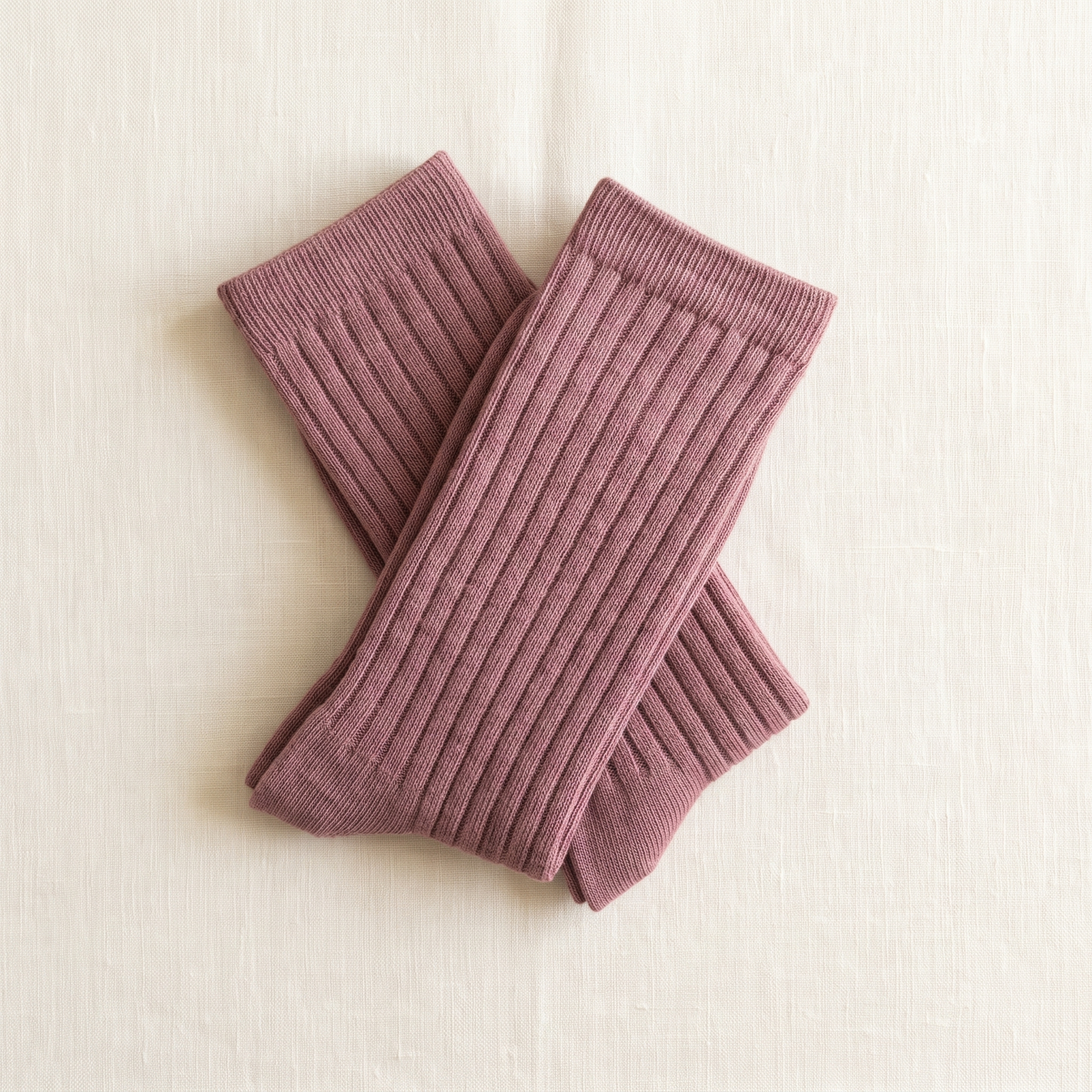 Dusty Rose ribbed lounge socks folded on ivory linen; colour reference for a pack of five matching pairs.